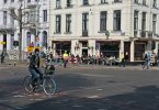 a person riding a bicycle on a street